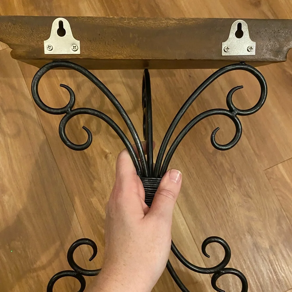 Brown and black iron and wood wall shelf